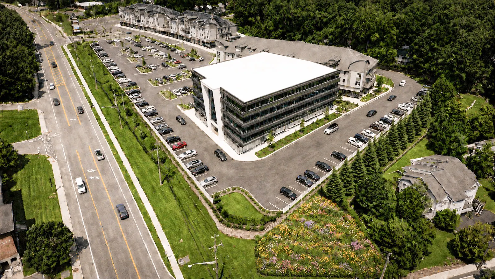 Top-down aerial photo of the building, its surface parking and Route 59 alongside
