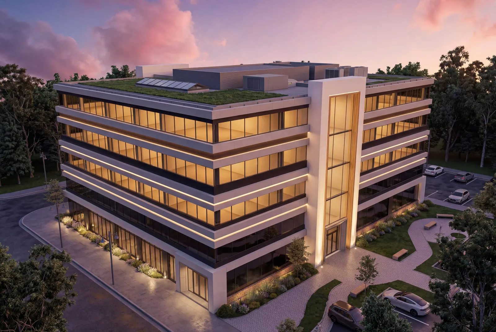 Aerial evening view of the building with warm light glowing along each floor