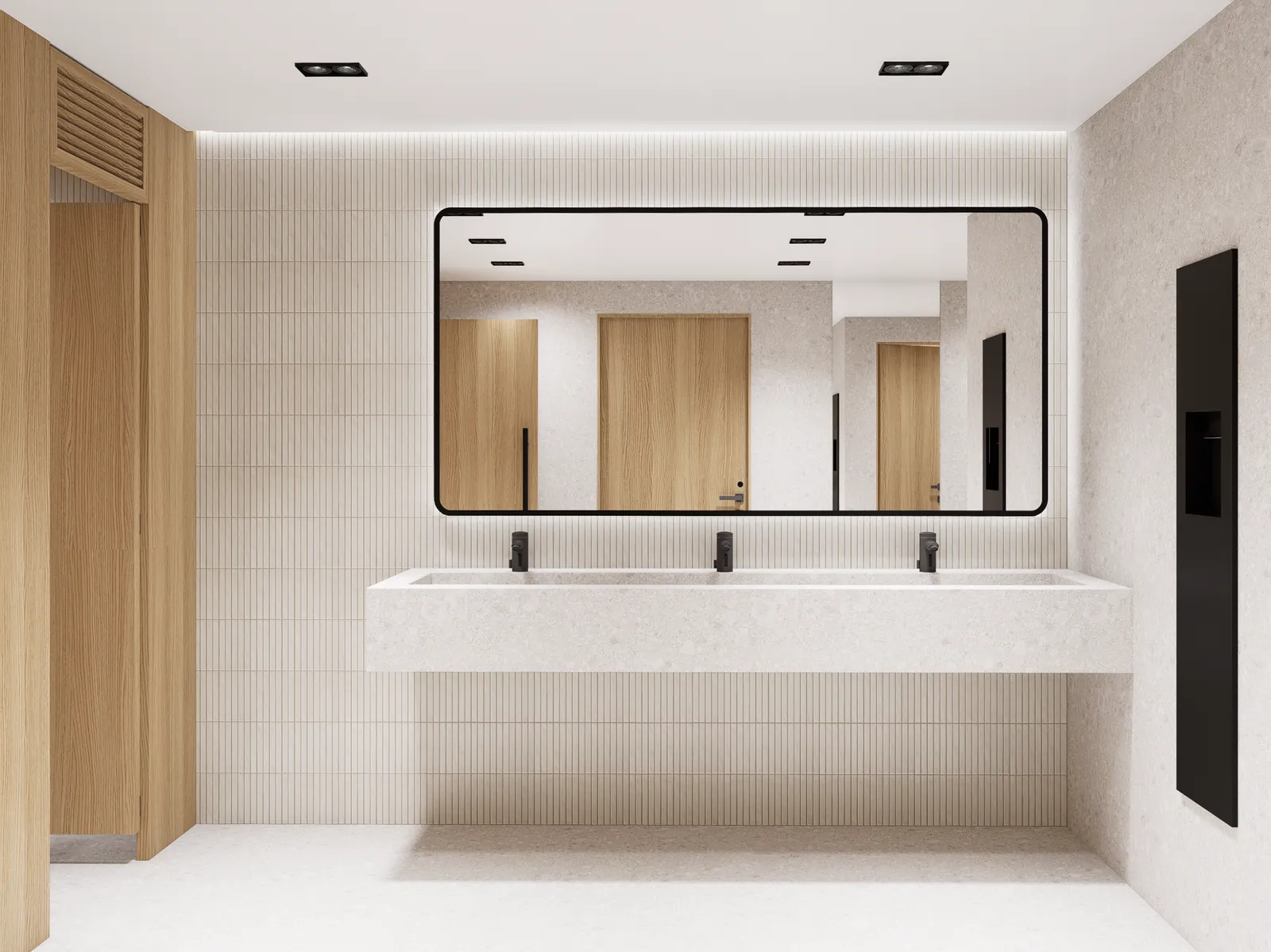 Restroom vanity with a stone trough sink, black touchless fixtures and a backlit mirror